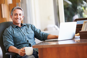 Man at home studying online
